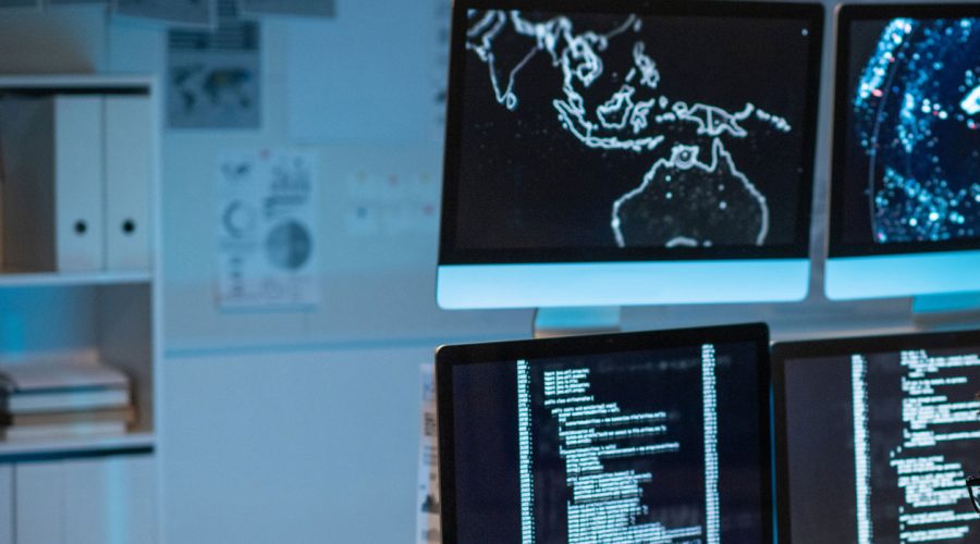 Security operations center with real-time network maps and code monitoring — showcasing McNallan Technology’s proactive IT support for Minneapolis enterprises